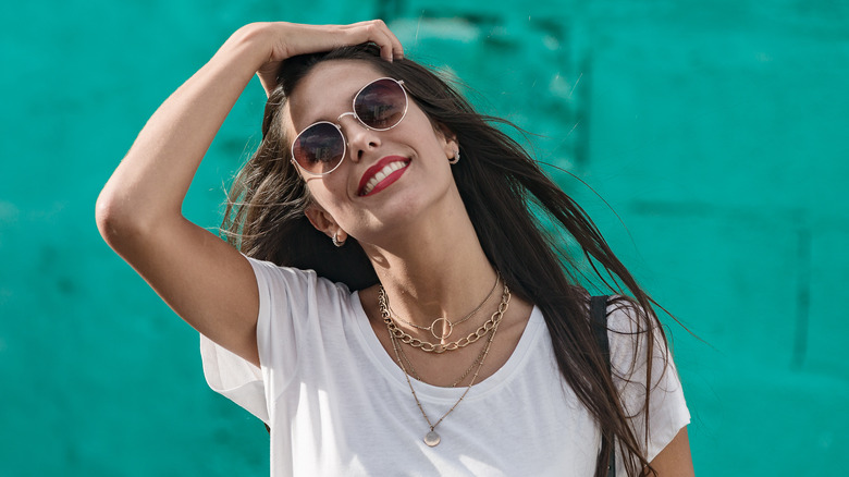 A young woman wearing necklaces 