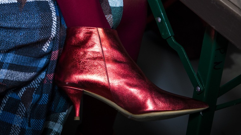 A woman wearing kitten heel boots