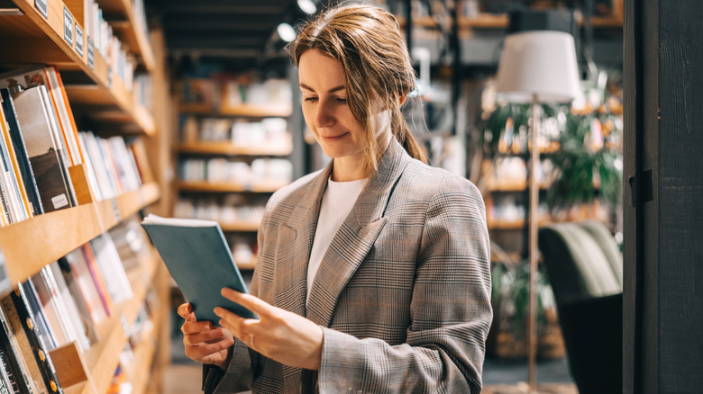 Woman looking at a book