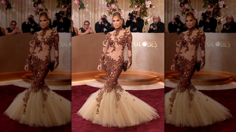 Jennifer Lopez on the red carpet in a brown and nude mesh