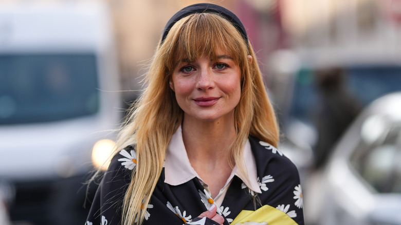 A woman with bangs and a headband