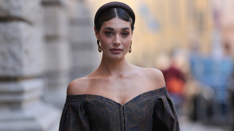 A woman with a black headband on