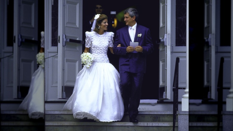 Caroline Kennedy emerging from a church in a wedding gown with Ed Schlossberg