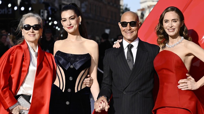 Meryl Streep, Anne Hathaway, Stanley Tucci, and Emily Blunt smiling together on "The Devil Wears Prada 2" red carpet
