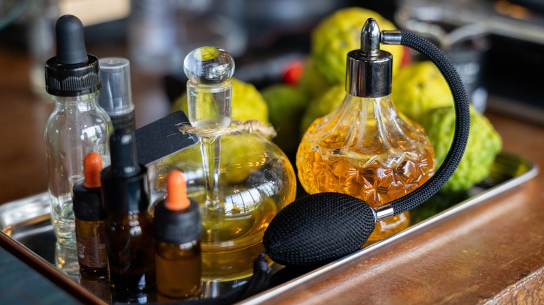 A selection of perfumes in bottles on a tray