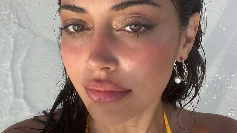 Woman at the beach wearing blush