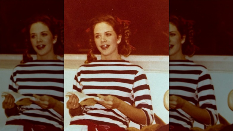 Young Meg Ryan reading a book