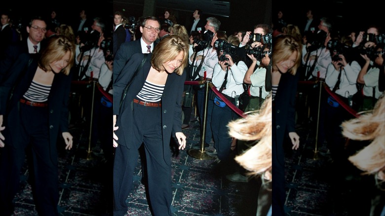 Meg Ryan walking by photographers in 1993