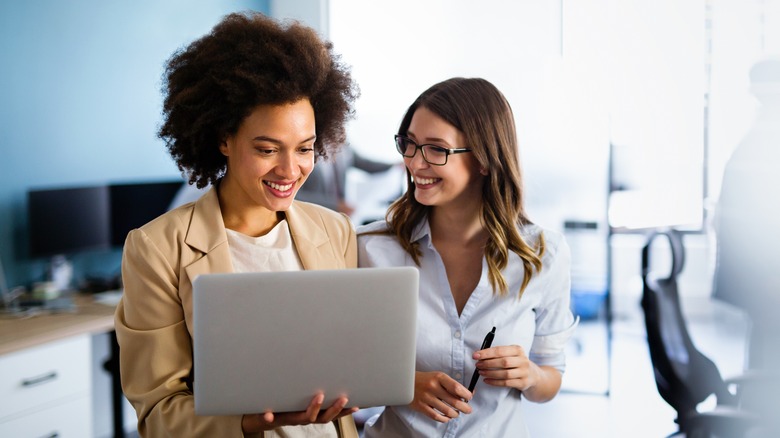 Two smiling businesswomen