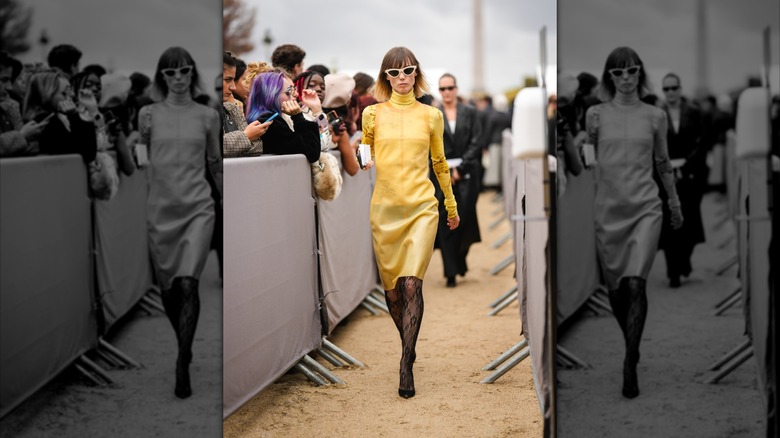 A model walking down Dior runway