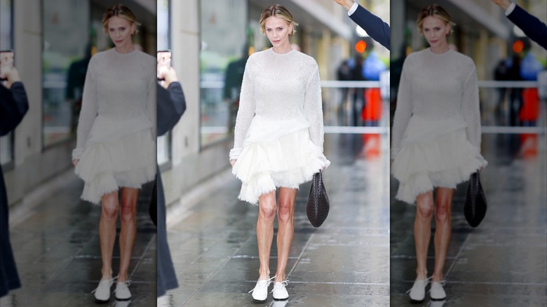 Charlize Theron in an all-white outfit, including white jazz shoes