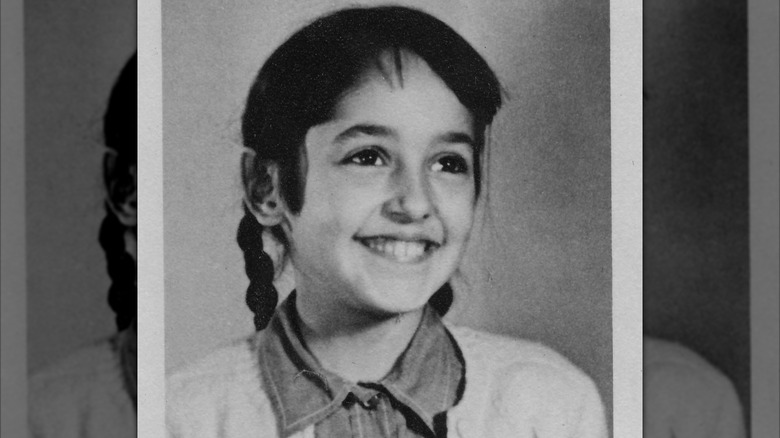 Young Joan Baez smiling in her elementary school photo