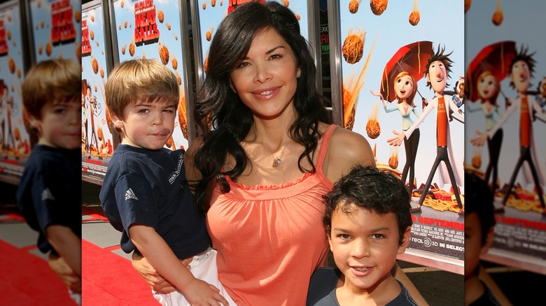 Lauren Sánchez Bezos posing with her two young sons on the "Cloudy With A Chance Of Meatballs" red carpet in 2009