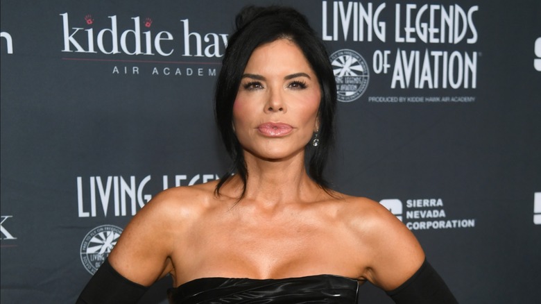 Lauren Sánchez Bezos posing on the red carpet in a strapless black dress in 2024