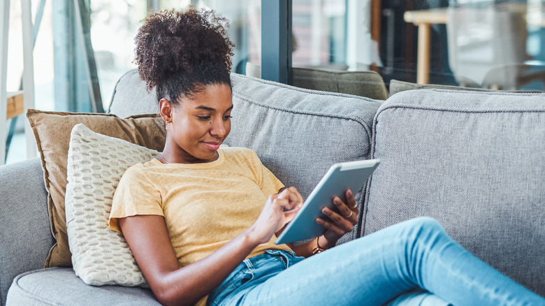 Woman reading Kindle