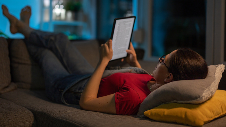 Woman reading Kindle