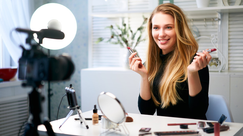 Woman giving a makeup review 