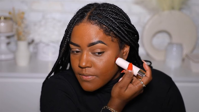 Woman applying contour