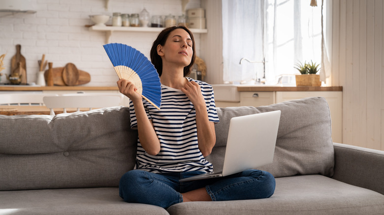 Woman holding a fan