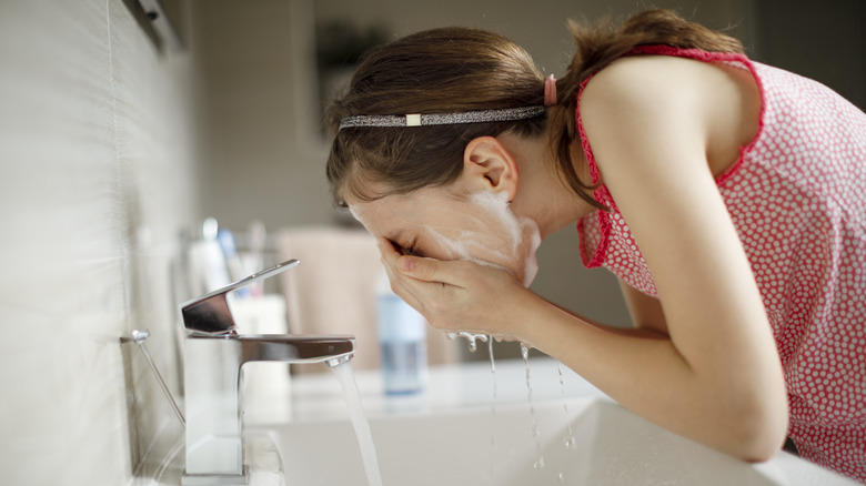 Person washes their face