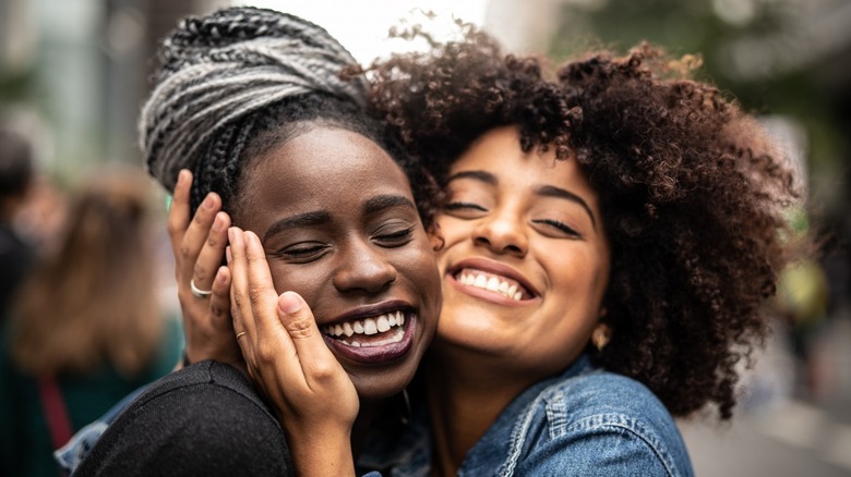 Two women smiling