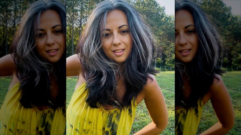 A woman with multiple gray tones in her hair