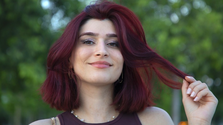 A woman with dark red hair