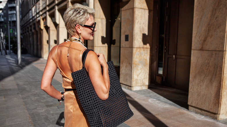 Woman with woven bag