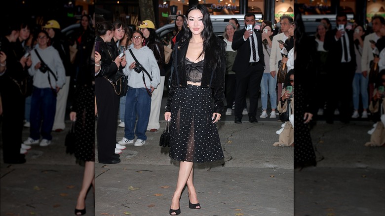 Woman wearing black polka dot skirt