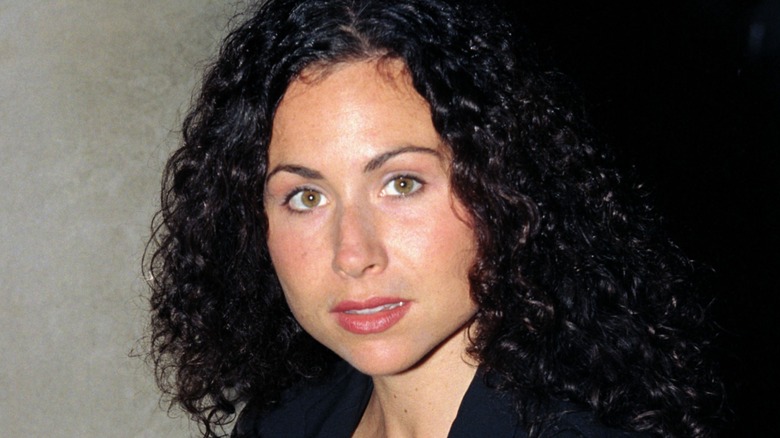Minnie Driver with a neutral expression at a movie premiere in the '90s