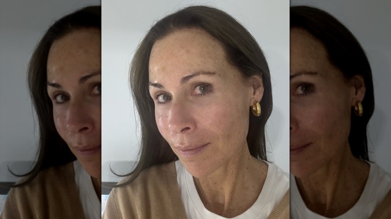 Minnie Driver posing for a selfie with no makeup in 2024