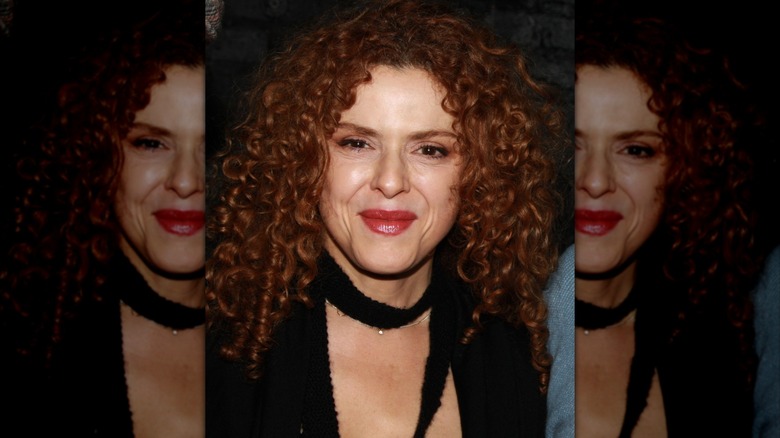 Bernadette Peters smiling in a black outfit at an event in 2008.