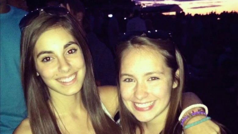 Kristen Vaganos smiling with her arm around a friend in 2012