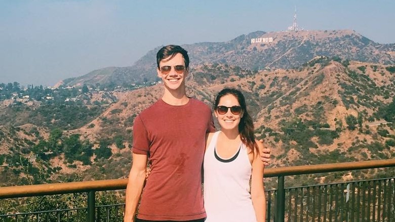 Kristin Vaganos posing in front of the Hollywood sign with a friend in 2017