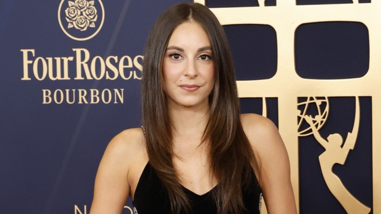Kristin Vaganos posing in a black dress on the red carpet at the 52nd Annual Daytime Emmy Awards