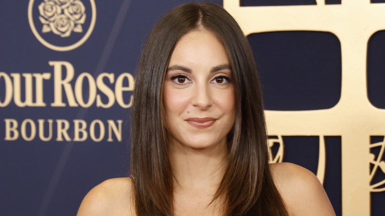 Kristen Vaganos slightly smiling on the red carpet