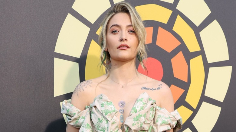 Paris Jackson posing on the red carpet with a blond bob in 2021