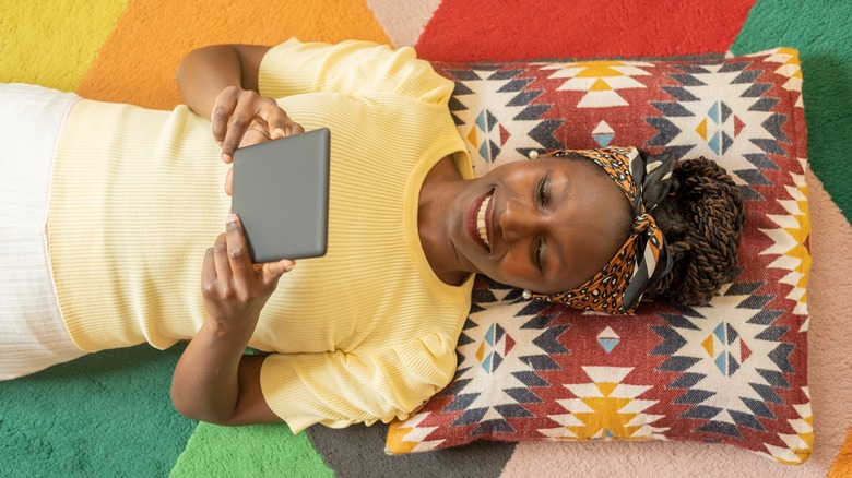 woman reading kindle