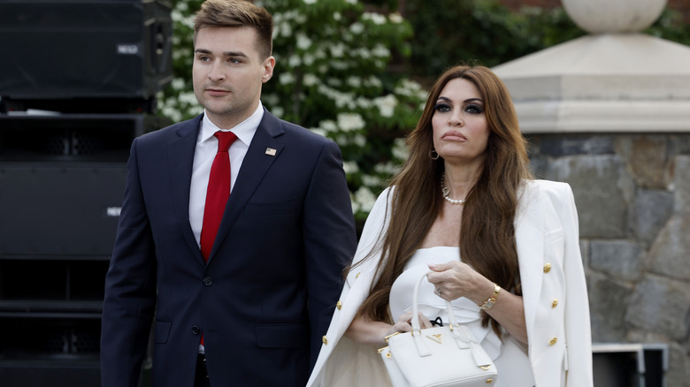 Kimberly Guilfoyle with security in 2023 at Trump's golf course