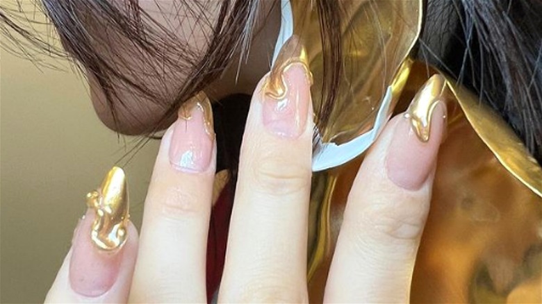 3D gold-tipped French manicure