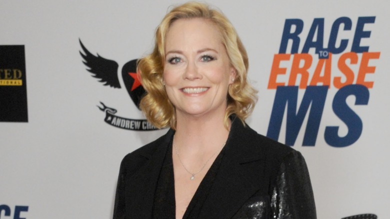 Cybill Shepherd smiling on the red carpet in 2012 in a black jacket