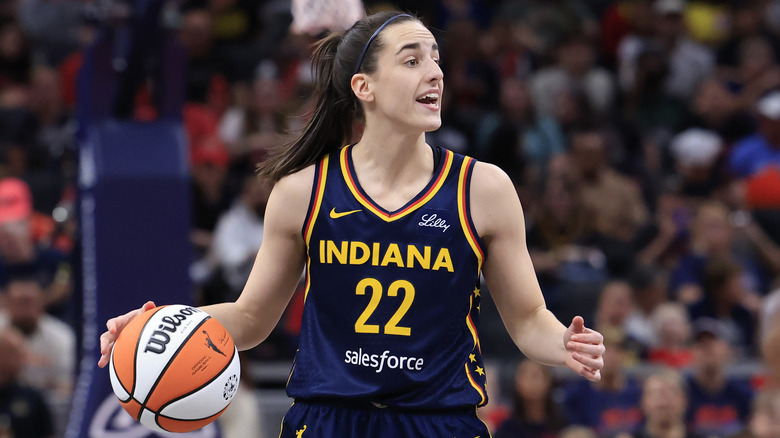 Caitlin Clark playing basketball