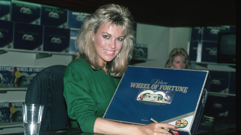 Vanna White posing with a Wheel of Fortune board game in 1986