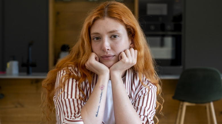 Woman with red hair and brown eyes