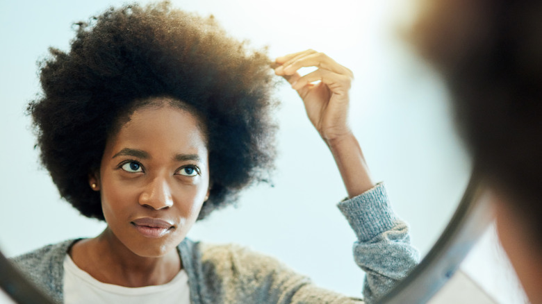 Woman touching hair