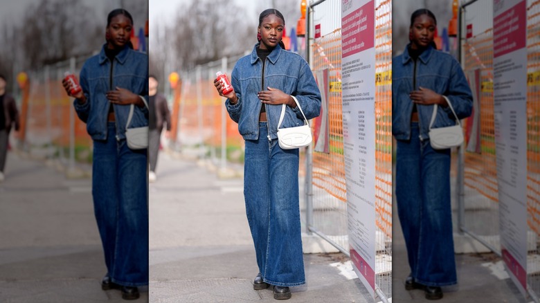 A woman in medium-wash denim pieces