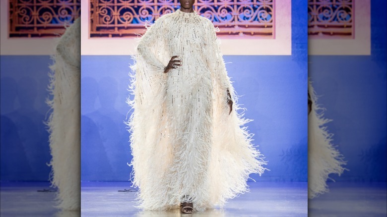 model in white sparkly mumu
