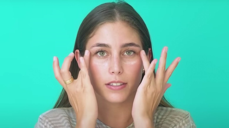 Applying eye cream 
