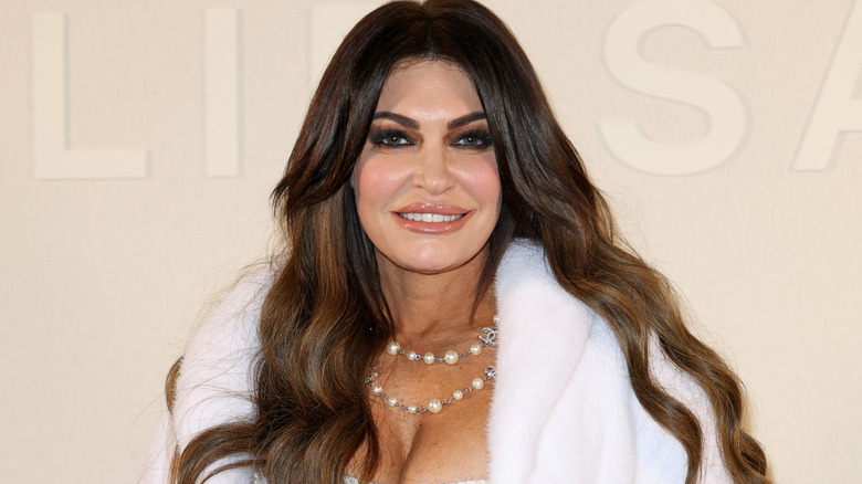 Kimberly Guilfoyle smiling in formal wear