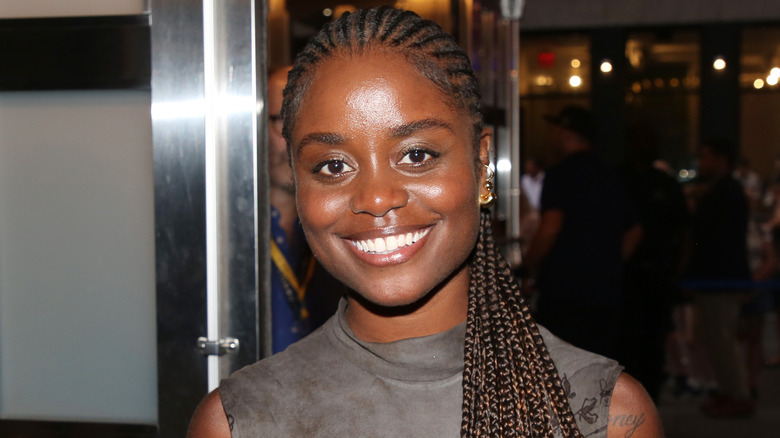 Denée Benton smiling with braids